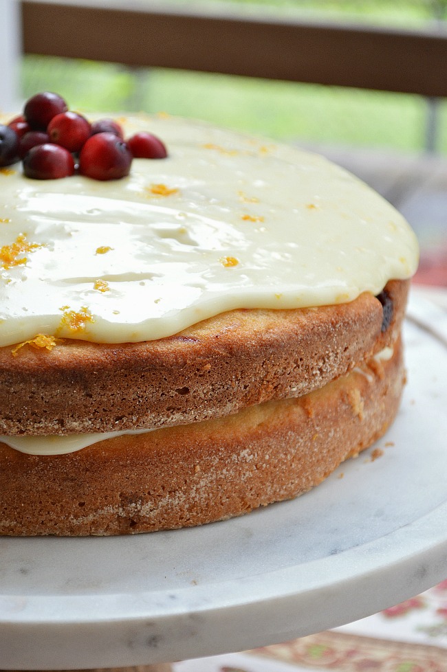 Make the most amazing Christmas dessert with this Gluten Free Cranberry Clementine Cake with White Chocolate Ganache. There are more uses for cranberry sauce than just garnishing turkey!